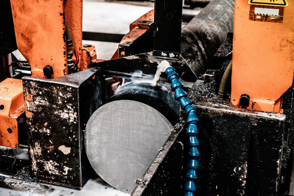 Bandsaw cutting steel round bar